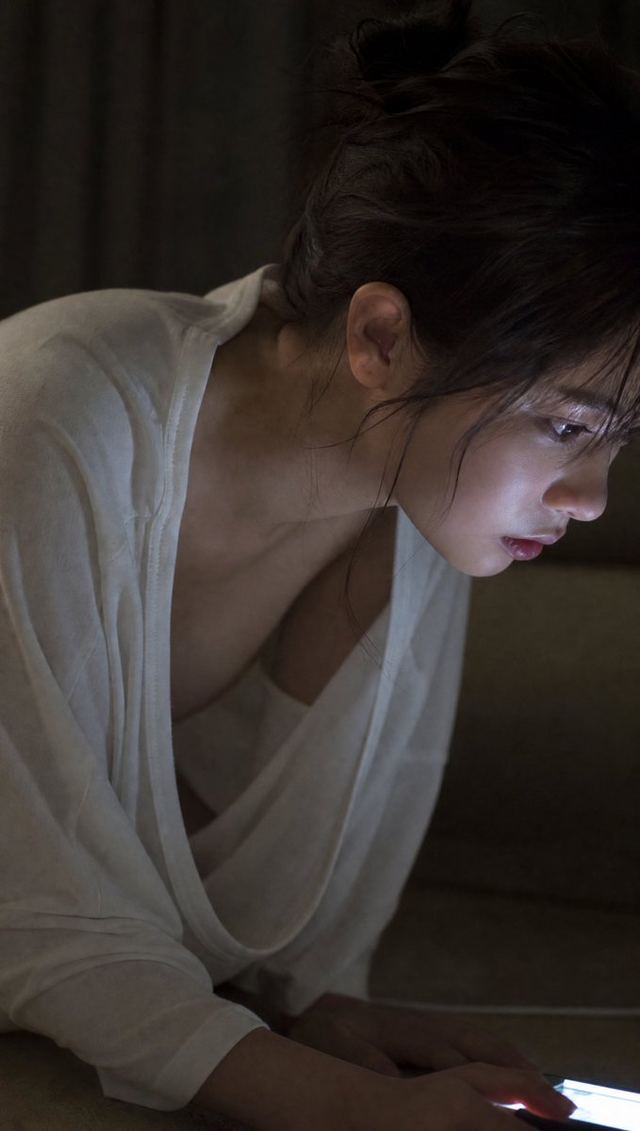 Moody Woman Looking at Phone — AI image prompt sample